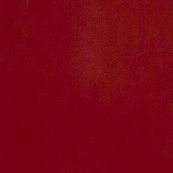 Red leather sample with mottled texture against a red background, displaying “moroso” label; matte finish, deep saturated color, material designation.